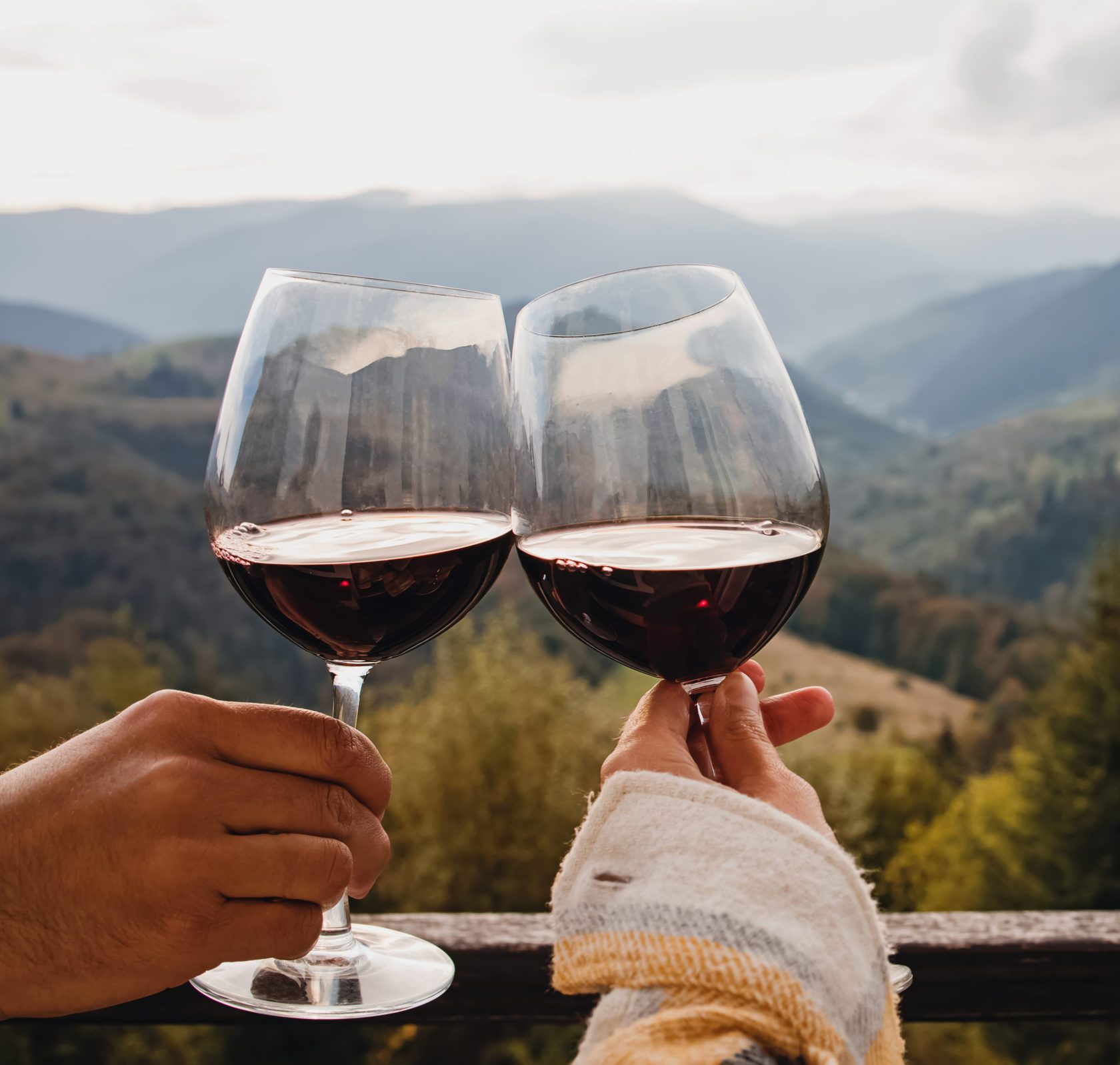 Man and woman have glass of red wine